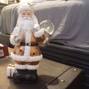Festive Santa Claus Figurine with Gifts